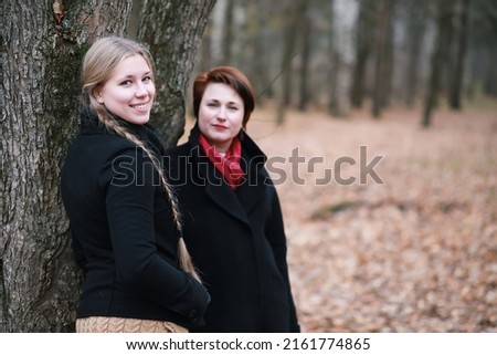 Similar – Image, Stock Photo happy twin sisters stand on a bridge in Erfurt and laugh into the camera