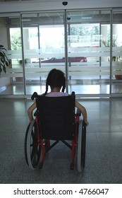Young Girl On Wheelchair Leaving Hospital