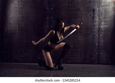 Young Girl In Oriental Style With Katana