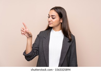 Young Girl Over Isolated Background Touching On Transparent Screen