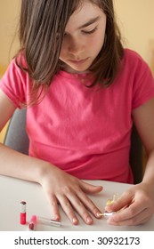 Young Girl Painting Her Nails