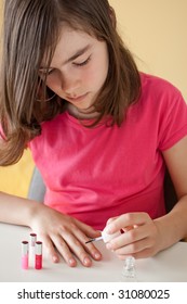 Young Girl Painting Her Nails