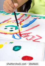 A Young Girl Painting A Self Portrait...signing It.