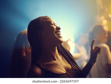 A young girl partying in a club and moving to the music. This concert was created for the sole purpose of this photo shoot, featuring 300 models and 3 live bands. All people in this shoot are model