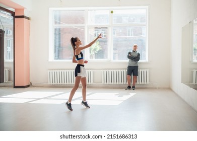 A Young Girl Performs A Coach's Task For Coordination And Quick Reaction Under The Guidance Of Her Coach