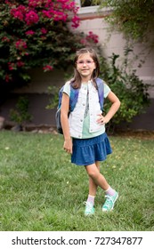 A Young Girl With Pink Glasses Is Excited And Nervous For Her First Day Of School.
