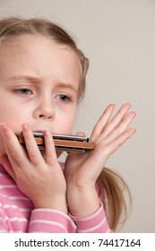 Young Girl Play Blues Harmonica