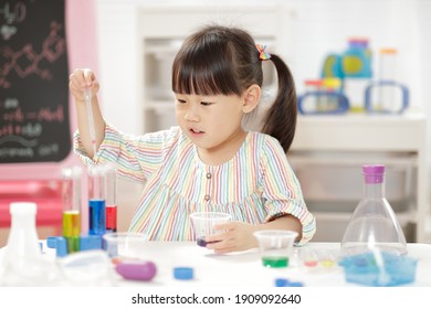 young  girl  play science experiments for homeschooling 