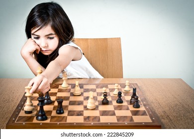 Young Girl Playing Chess.