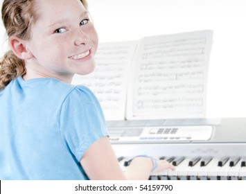 Young Girl Playing Electric Piano