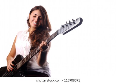 Young Girl Playing On Bass Guitar