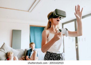 Young Girl Playing VR Game At Home