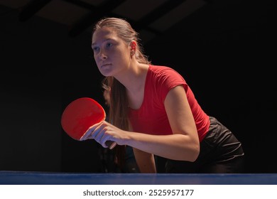 Young girl plays table tennis closeup - Powered by Shutterstock