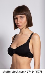 Young Girl Portrait 3/4 With Short Hair Cut And In Black Bra On White Background, Model Polaroids, Snaps For Modelling