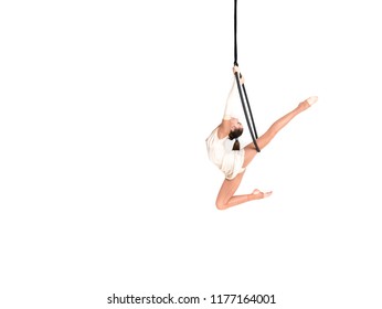 Young girl posing in an airy ring on a white background. Aerial hoop fly