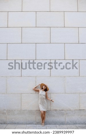 Similar – Image, Stock Photo Happy woman jumping in front of stone wall background