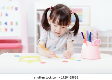 Young Girl Practice Drawing Different Shapes For Home Schooling