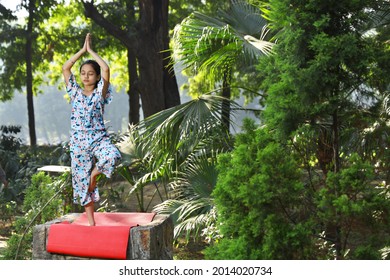 A Young Girl Practicing Early Morning Yoga In The Park For Mind Body Soul 