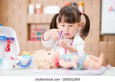 Young Girl Pretend Play Doctor Role  At Home 