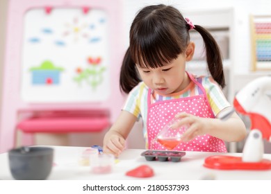 Young  Girl Pretend Play Food Preparing At Home 