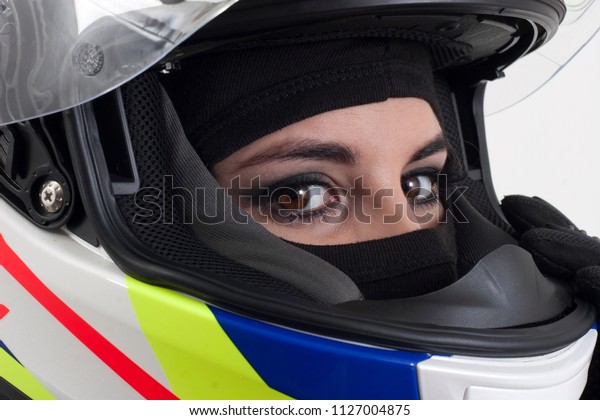 a young girl in a racing\
helmet