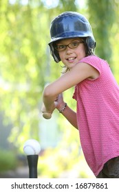 Young Girl Ready To Hit T Ball