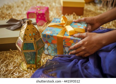 A Young  Girl Receiving A Gift. Eid Celebration -a Happiest Moment For A Kids. Stock Photo.