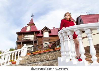 Young Girl In Red Cardigan On The Background Of An Old Castle