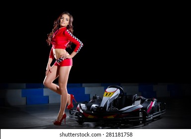 Young Girl In Red Racing Costume Isolated