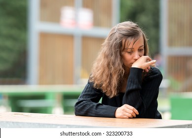 Young Girl Resting And Regretting The Made Decision.