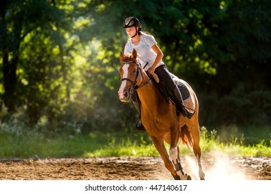 Young Girl Riding A Horse 