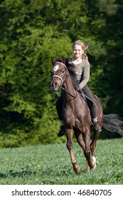 Young Girl Riding On Horse