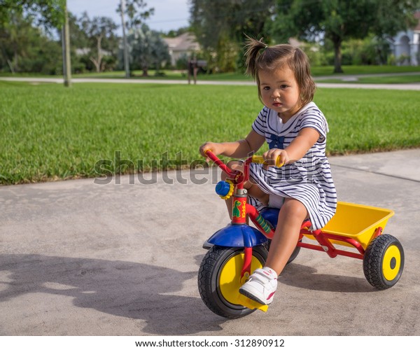 riding a tricycle