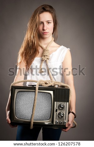 young girl with rope holding retro television