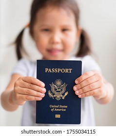 Young Girl Is Showing Off Her Newly Issued United States Passport. High Quality Photo