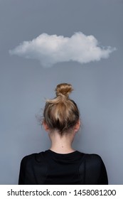 Young Girl Simple Hairstyle Back View With Cloud Over Her Head. Fashionable And Simple Hairdresser Work. Fashion Model, Trendy Woman. Hair In Top Bun Close-up Photo. Mental Health Metaphor Concept