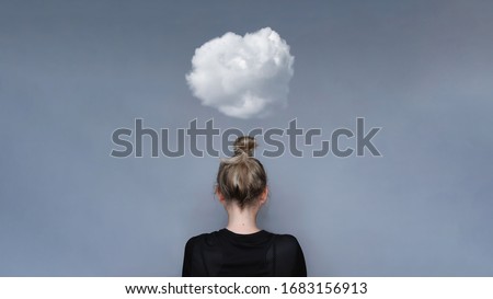 Young girl simple hairstyle back view with cloud above her head. Depression, loneliness and quarantine concept. Fashion model, trendy woman. Mental health metaphor concept