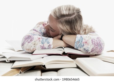 A Young Girl Sits At A Table And Sleeps On Books. Learning Difficulties. White Background.