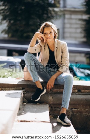 Similar – Blonde young caucasian woman smiling on steps