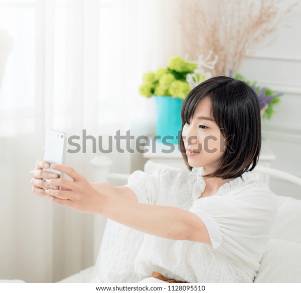 Young Girl Sitting On Bed Make Stock Photo Edit Now 1128095510