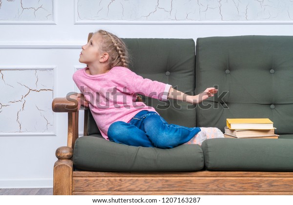 Young Girl Sitting On Couch Turned Stock Photo 1207163287 | Shutterstock