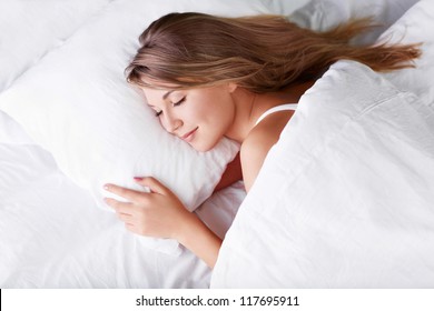 Young Girl Sleeping In Bed