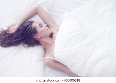 Young Girl Sleeping In Bed, Top View