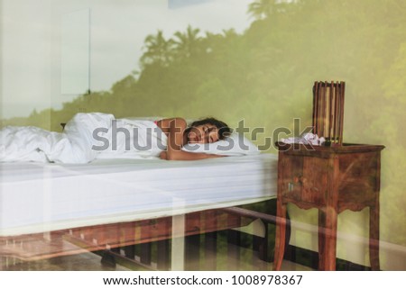 young girl sleeping on bed in hotel 