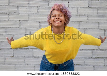 young girl smiling on the city street
