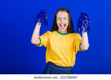 Young Girl, Soccer Fan From Brazil. Holding Cheerleader Pompom