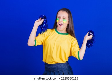 Young Girl, Soccer Fan From Brazil. Holding Cheerleader Pompom