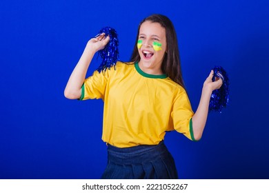 Young Girl, Soccer Fan From Brazil. Holding Cheerleader Pompom