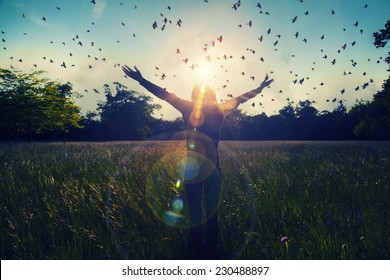 Young girl spreading hands with joy and inspiration facing the sun,sun greeting,freedom concept,bird flying above sign of freedom and liberty  - Powered by Shutterstock