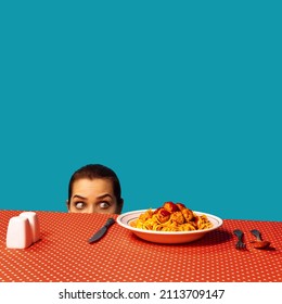 Young Girl Spying On Spaghetti With Meatballs On Plaid Tablecloth Isolated On Bright Blue Background. Food Pop Art Photography. Vintage, Retro Style Interior. Complementary Colors, Copy Space For Ad